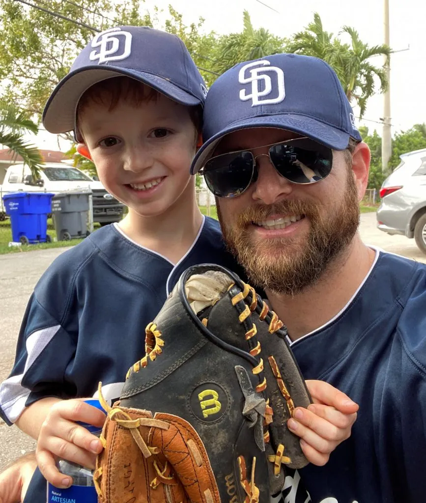 Dr. Berley with a baseball glove and his son