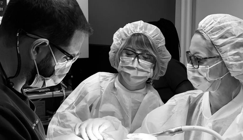 Dr. Berley operating on a patient