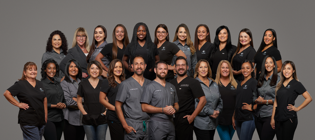 The whole plantation oral surgery staff posing together